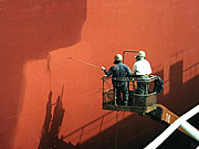 Spraying paint onto a ship bottom