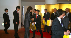 Attendants being presented with souvenirs